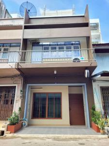 a building with a balcony on top of it at Ama'home in Hat Yai