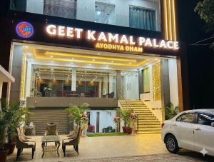 a car parked in front of a building at GeetKamal Palace Ayodhya Dham in Ayodhya