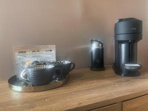 a coffee maker and two cups on a counter at The Foxes Hole - Uk49085 in Winewall +8 photos