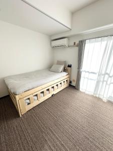 Llit o llits en una habitació de Hanazono405