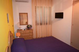 Μια τηλεόραση ή/και κέντρο ψυχαγωγίας στο Bed &Breakfast Pinetamare