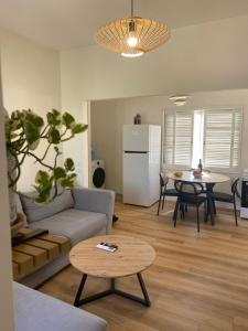a living room with a couch and a table at Rivers view in kibbutz Dafna in Dafna