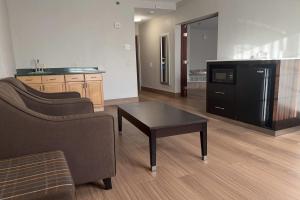 a living room with a couch and a coffee table at Days Inn by Wyndham Budd Lake in Budd Lake
