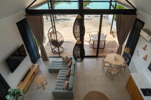 an overhead view of a living room with a couch and a table at Sea Escapes Villas in Thong Sala