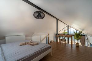 a bedroom with a bed and a dining room at Sea Escapes Villas in Thong Sala +93 photos