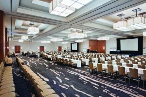 a large room with rows of chairs and a screen at Hyatt Regency Wichita in Wichita +57 photos