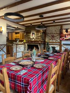 a dining room with a table and chairs and a fireplace at Villa Martina in Smilyan +44 photos
