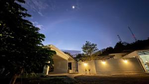 a house at night with the lights on at My Home Villa Phangnga in Phangnga