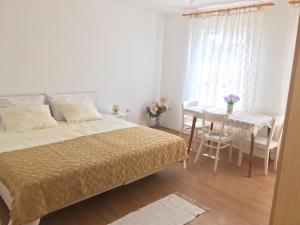 Postel nebo postele na pokoji v ubytování Apartment Silvana II