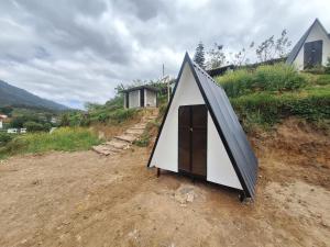a small tent sitting on top of a hill at Secret valley vattavada in Vattavada
