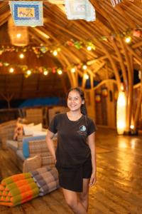 a woman is standing on a dance floor at Nusa View - Oceanfront Rentals in Nusa Lembongan +291 photos