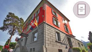 a building with a clock on the side of it at Boutique Hotel Waldegg in Lucerne