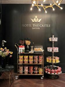 a display of food on a cart in front of a hotel the castle at Hotel the Castle Jamsil Sports Complex in Seoul
