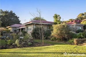 a house with a garden in front of it at Hills Manor House in Greenmount