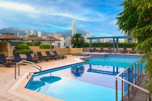 a swimming pool on the roof of a building at Sheraton Hong Kong Hotel & Towers in Hong Kong