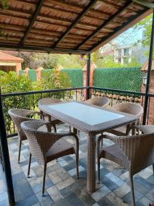 a table and chairs sitting on a patio at "Ламази"Домашняя гостиница in Kobuleti