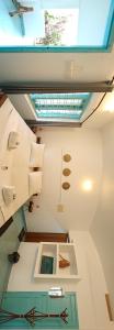 a room with a skylight and a ceiling at Yog Inn in Varkala