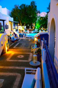 a view of a pool with tables and chairs at Samson΄s Village in Perissa