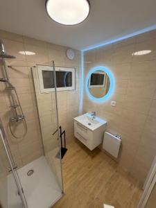 a bathroom with a sink and a shower at Prázdninový dům Centrum Pastvinská přehrada in Nekoř +19 photos