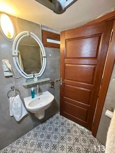 a bathroom with a sink and a mirror at ARİFBEY KONAGİ otel in Şahinbey +37 photos