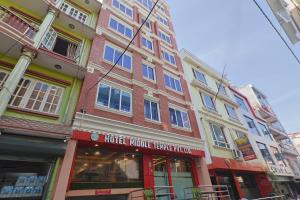a facade of a building with a hotel whole foods at OYO 839 Hotel Middle Temple in Kathmandu