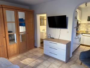 a kitchen with a tv on the wall and a counter at Villa Nikki in Bilice
