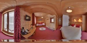 a living room with a train car shaped room at Hôtel L'Accroche Coeur in La Rosière +38 photos