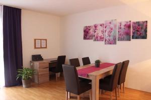 a dining room with a table and chairs at APARTHOTEL 1A in Zwickau