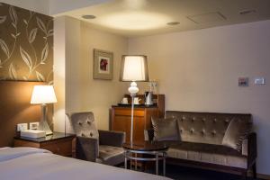 Ένα ή περισσότερα κρεβάτια σε δωμάτιο στο Delight Hotel
