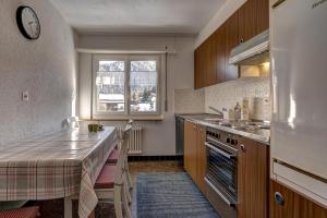 a kitchen with a table and a window in it at Appartement Tzoum'Azur 6 in La Tzoumaz