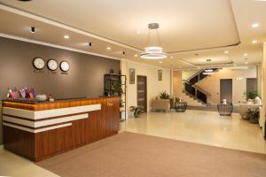 a lobby of a hospital with a reception desk at Inga Hotel Yerevan in Yerevan