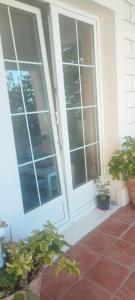 a front door of a house with potted plants at Guesthouse Alliya in Dubrovnik +10 photos