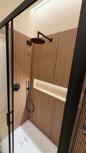 a bathroom with a shower with a shower head at Milan house 2 in Samarate +12 photos