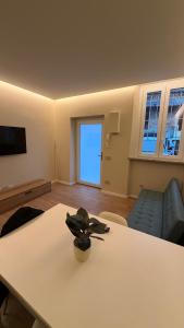 a living room with a table and a couch at Milan house 2 in Samarate