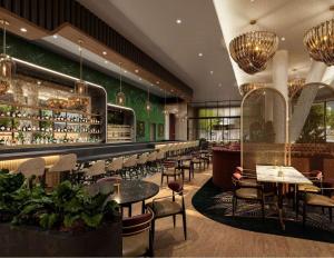a restaurant with tables and chairs and a bar at Hotel Phoenix Atlanta in Atlanta