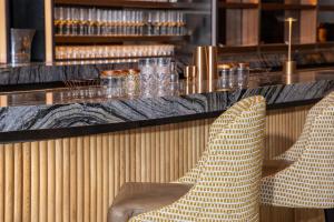two chairs sitting at a counter in a restaurant at Hotel Phoenix Atlanta in Atlanta +104 photos