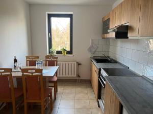 a kitchen with a table and a counter top at City Apartment 1 in Euskirchen