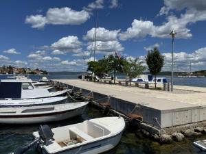 a group of boats are docked at a dock at Villa Nikki in Bilice +3 photos