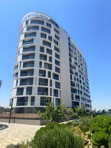 a tall apartment building with a blue sky in the background at Unit 4913 - Ellipse Waterfall in Midrand