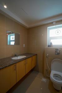 a bathroom with a sink and a toilet at Maison Miraj Hostel in Muscat +69 photos