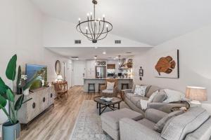 a living room with a couch and a table at Harbour Oaks, Unit 618 in Saint Simons Island