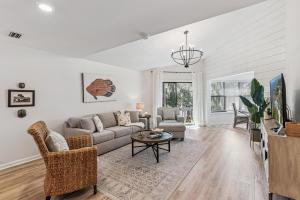 a living room with a couch and a table at Harbour Oaks, Unit 618 in Saint Simons Island