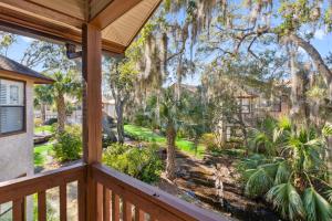a balcony with a view of a yard at Harbour Oaks, Unit 618 in Saint Simons Island