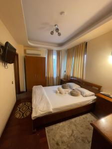 a bedroom with a large bed with white sheets at El Locanda Boutique Hotel in Constanţa +89 photos