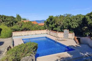 a swimming pool in the middle of a yard at Maison avec vue mer à Propriano in Propriano