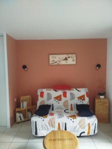 a bedroom with a bed and a table at Chez Louis in Levernois +46 photos