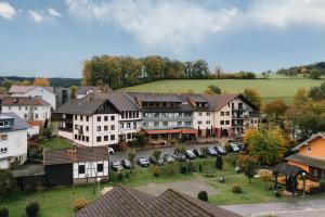 an aerial view of a town with cars parked at hotel zentlinde in Mossautal