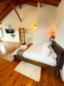 a bedroom with a large bed in a room at Nof Harim נוף הרים in Even Menahem +15 photos
