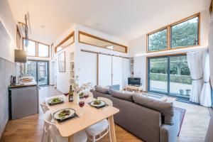 a living room with a couch and a table at The Orchard Annexe, Framlingham in Framlingham
