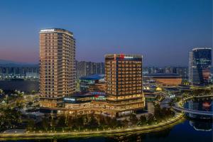 a view of a city with tall buildings at night at Deqing Marriott Hotel in Huzhou